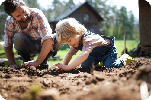 Father and son working in the yard