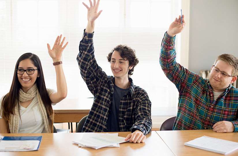 Vermont Students Raising Hands in Class