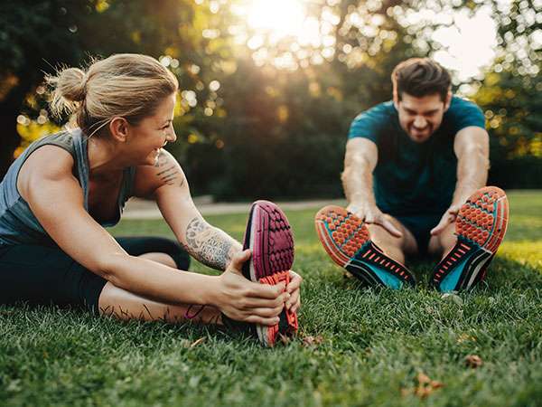 couple stretching after run