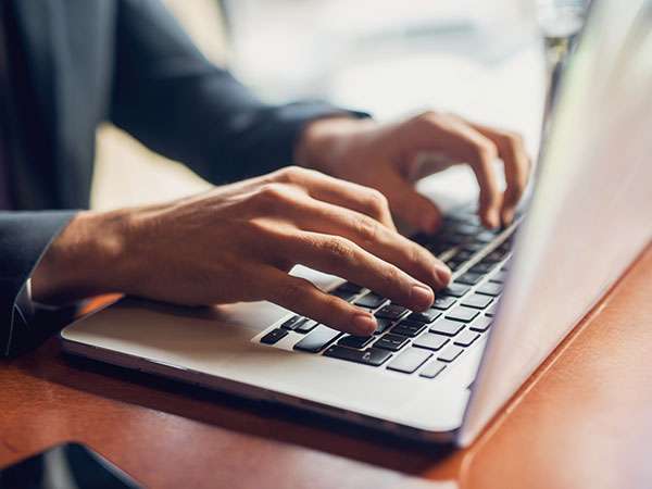 filling-out-paperwork-on-computer