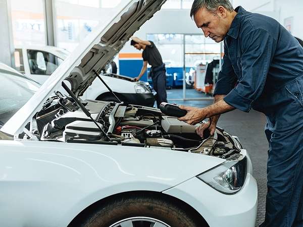 mechanic fixing car